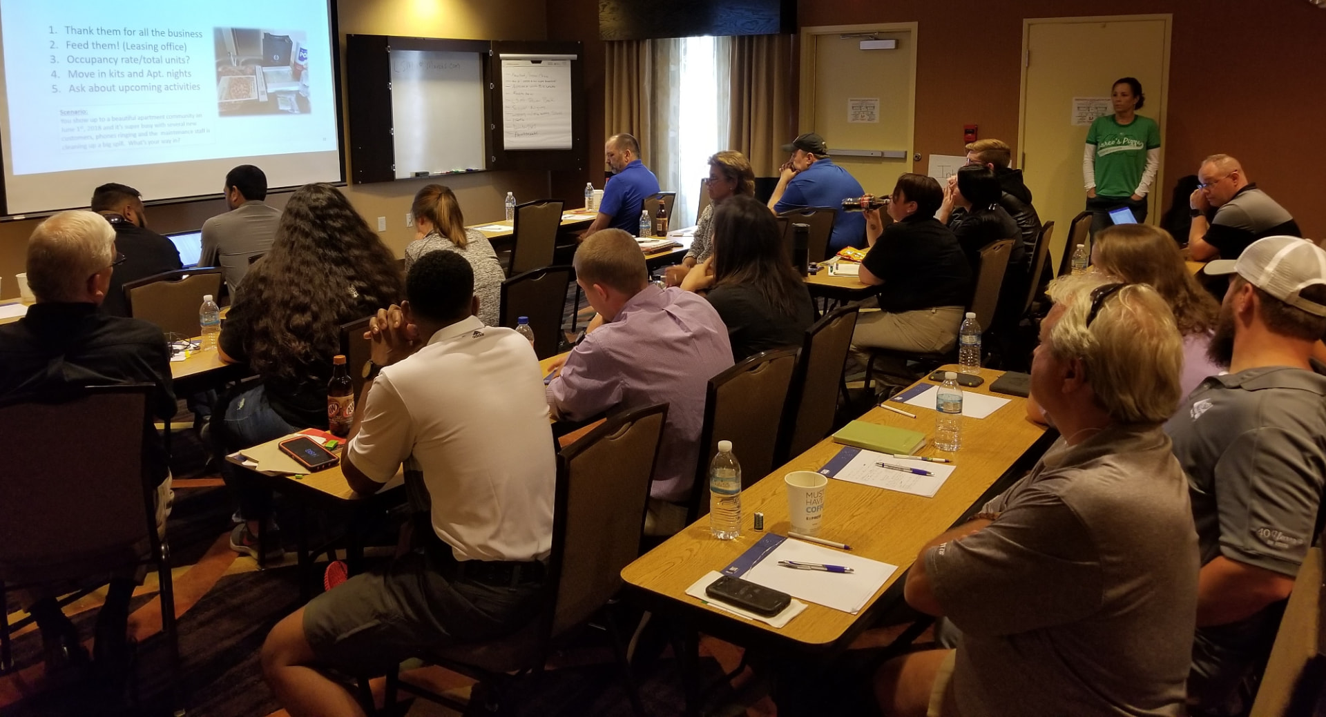 Operators in a full-room Local Store Marketing workshop taking notes