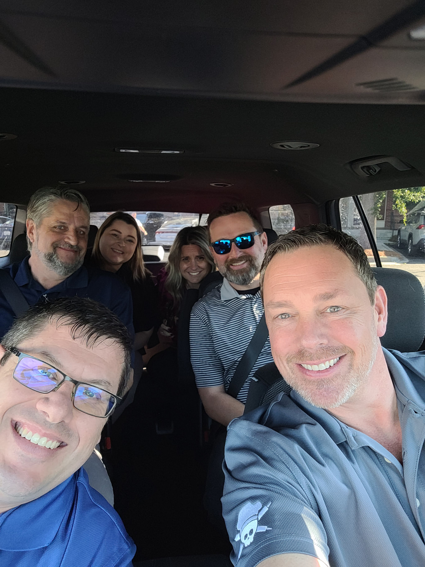 Field team in the van between route stops